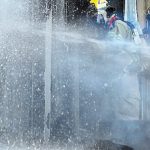 Fireman fighting a fire at a distillery